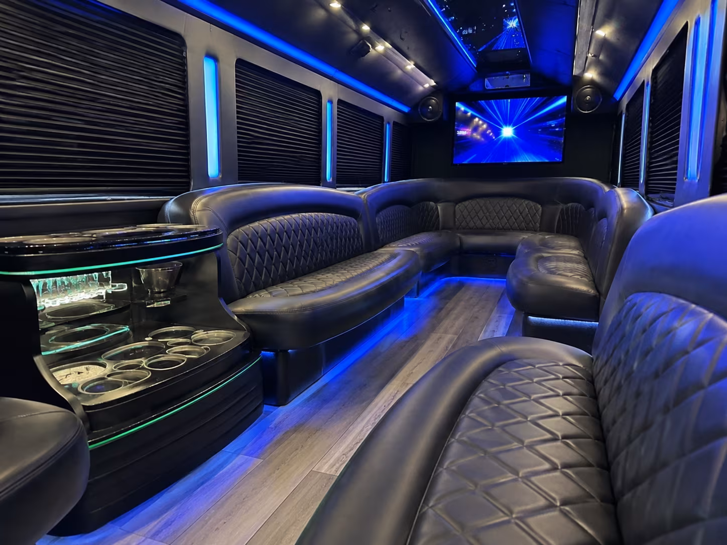 Friends laughing during a party bus celebration in Las Vegas